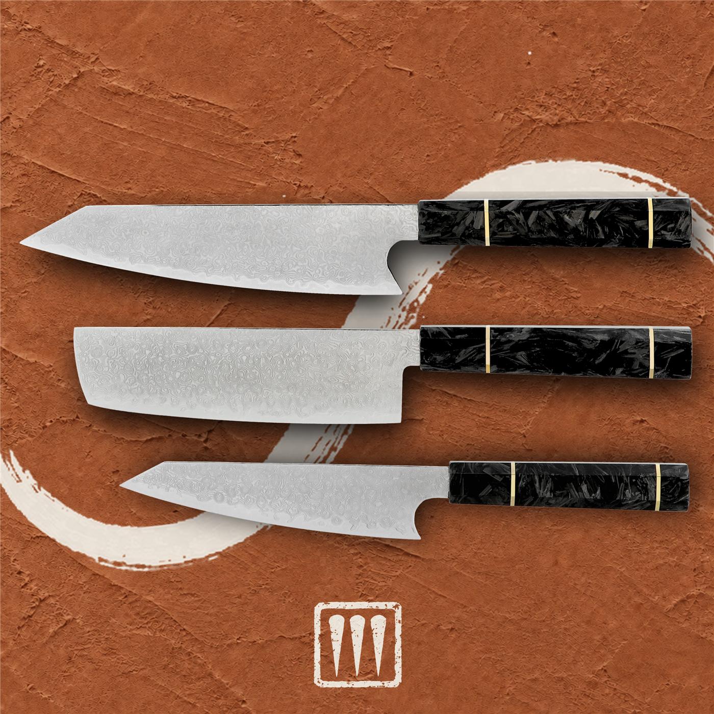 Three Damascus knives — Kiritsuke, Nakiri and Utility — with carbon-fibre handles, laid flat on terracotta plaster beside a brushed ivory circle